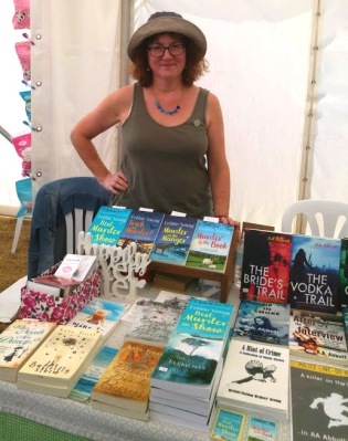 photo of Debbie in hat on bookstall
