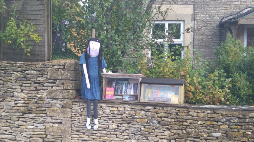 photo of Matilda scarecrow with Little Free Library