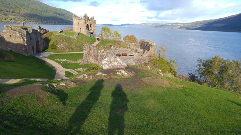 Photo of tall shadow of Debie cast over castle by Loch Ness