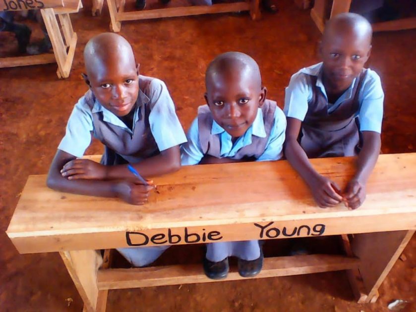 photo of children at desk with Debbie Young's name on 