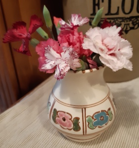 small pottery vase of pinks
