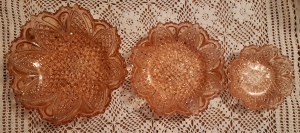 trio of pink pressed glass bowls